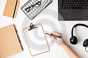 Top view of office desk. Table with laptop and office supplies. Flat lay home office workspace, remote work, distant learning,