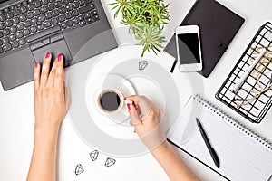 Top view of office desk. Table with laptop and office supplies. Flat lay home office workspace, remote work, distant learning,