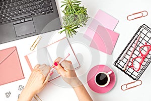 Top view of office desk. Table with laptop and office supplies. Flat lay home office workspace, remote work, distant learning,