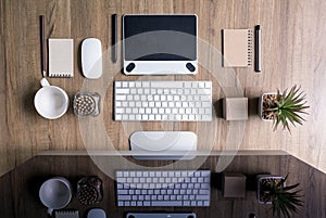 Top view of office desk work with computer, supplies,