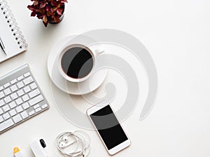 Top view of office desk workspace with notebook, smartphone and gadget on white background, graphic designer, Creative Designer co