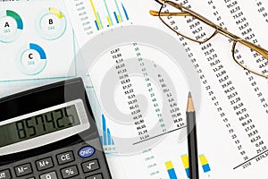 Top view office table desk. Financial report. Flat lay. Workspace with Business office supplies, Accounts number on the data paper