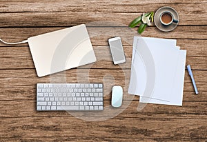 Top view. Office wooden desk with smartphone, hot coffee cup, paper, pencil, notebook, keyboard, mouse and copyspace for text