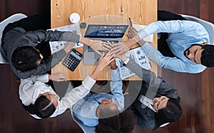 Top view office worker's hand stack shows solidarity in workplace. Concord