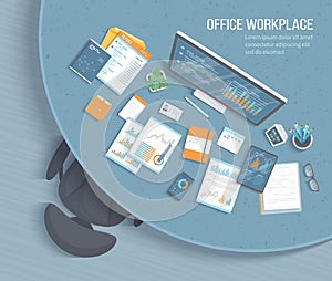 Top view of office workplace with round table, armchair, office supplies. Charts, graphics on a monitor screen tablet phone