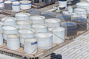 Top view of the oil refinery and petrochemical plant, oil and gas processing and storage tanks, industrial area.
