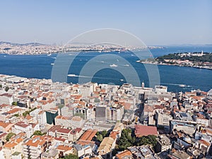 Top view of the old city of Istanbul and the Bosphorus, in the foreground low-rise buildings, against the backdrop of city hills