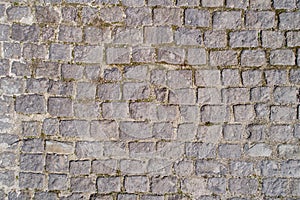 Top view of old cobblestone pavement. Street with granite cobblestoned pavement photo