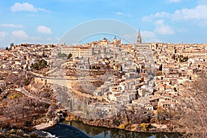 Top view of old medieval Toledo from hill in winter sunny day.