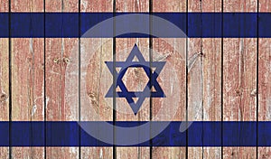Top view of Old Painted Flag of Israel on Dark Wooden Fence, wall. patriot and travel concept. no flagpole. Flag background. Plane
