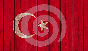 Top view of Old Painted Flag of Turkey on Dark Wooden Fence, wall. patriot and travel concept. no flagpole. Flag background. Plane