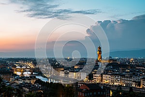 Top view of the Old Palace in Florence Town Hall tower by architect Arnolfo di Cambio in a warm summer late evening photo