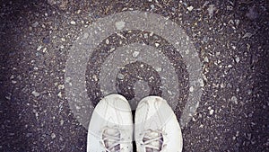 Top view of old sneaker on street with copy space, vintage style