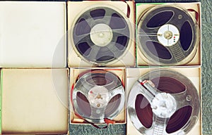 Top view of old sound recording tape, reel to reel type and box.