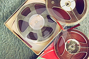 Top view of old sound recording tape, reel to reel type and box.
