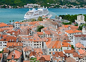 Top view of Old town Kotor and cruise ship in Bay of Kotor