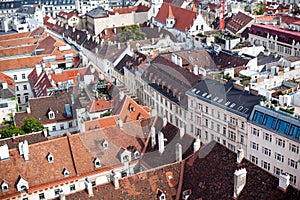 Top View of old town from St. Stephen`s Cathedral, Vienna, Austria. tiled roofs of european city