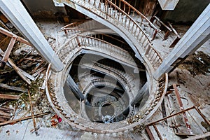 Top view of old vintage decorated spiral staircase in abandoned mansion