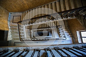 Top view of old vintage decorated staircase in abandoned mansion