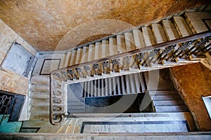 Top view of old vintage decorated staircase in abandoned mansion