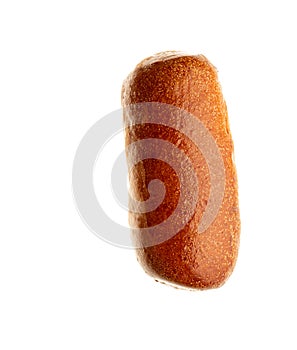 Top view of one fresh baked wheat bun for hot dog isolated on white background. Close-up of a single whole bread roll