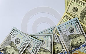 Top view of one hundred dollar bills on white background