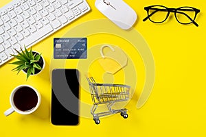Top view of online shopping concept with credit card and smart phone