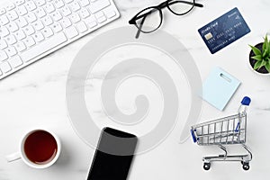 Top view of online shopping concept with credit card, smart phone and computer