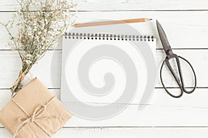 Top view of open book with pencil,flat lay image of workplace wi