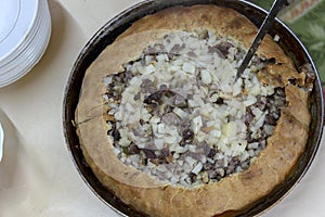 Top view on open meat pie. National tatar food