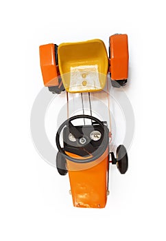 top view of orange vintage children& x27;s  pedal machine isolated on white background