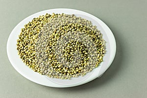 top view of organic dried hemp seeds in plate