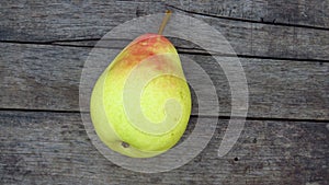 Top view. Organic Yellow Pear Fruit. Natural Pear Harvest on Wood Texture Background.