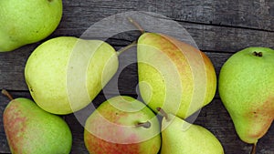 Top view. Organic Yellow Pear Fruits. Natural Pear Harvest on Wood Texture Background.