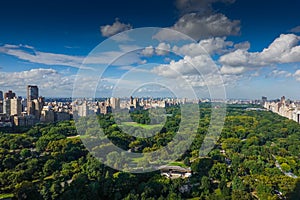 Top view over Central Park in Manhattan during a day with blue sky and white clouds in New York