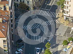 Top view over a crowd pedestrian crossing road intersection, Belgrade. Aerial view od traffic at busy scramble crosswalk