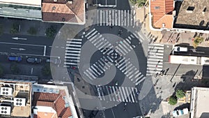 Top view over a crowd pedestrian crossing road intersection, Belgrade. Aerial view od traffic at busy scramble crosswalk