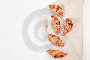 Top view over freshly baked croissants for breakfast