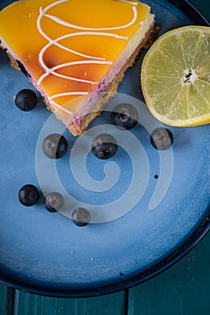 Top view over slice of lemon and blueberry cheese
