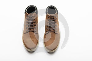 Top View of Pair of Brown Boots on White Background