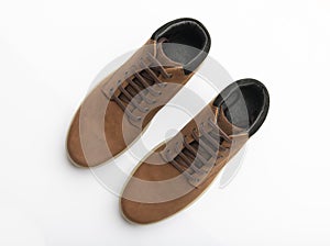 Top View of Pair of Brown Boots on White Background