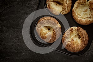 Top view of a pan filled with freshly baked Yorkshire Puddings