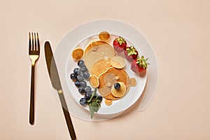 Top view of pancakes, blueberries and