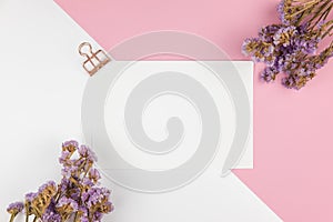 Top view of paper note and purple statice flower