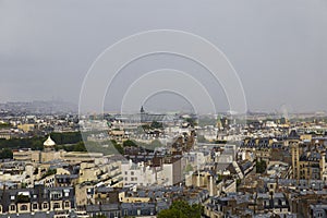 Top view of the Parisian neighborhoods and stormy sky in the far