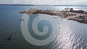 Top view park boat ramp and dock with motor boats with anglers fishing at Lake Grapevine, Texas