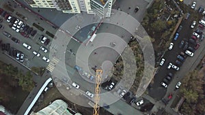 Top view of part of construction crane. Clip. Construction site with yellow tower crane shot from above. Aerial view of