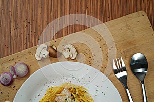 top view of partially hidden spaghetti carbonara lunch dinner meal