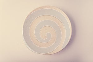 Top view of a pastel plate on a pastel peach background. Minimalism food photography. Geometric style.