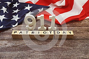 911 Patriot Day Word alphabet letters with USA flag on wooden background
